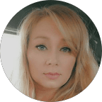 Circular portrait of a woman with long blonde hair, blue eyes, and a neutral facial expression.